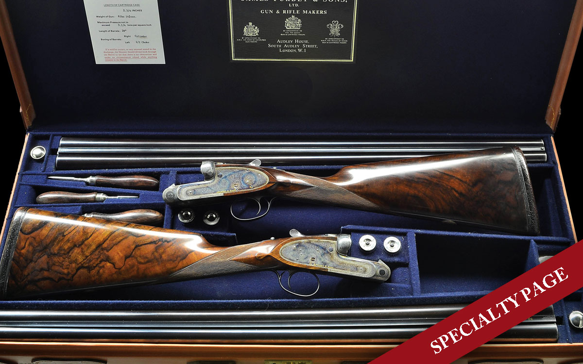 LOVELY PAIR OF JAMES PURDEY GOLD NAME HEAVY PROOF SIDELOCK EJECTOR SINGLE TRIGGER GAME GUNS MADE FOR NEIL SHEEHAN, PULITZER PRIZE WINNING AUTHOR, JOURNALIST AND RECEIVER OF PENTAGON PAPERS WITH CASE, EXTRA STOCKS AND TRAVEL CASES. 12 gauge, 2 3/4″